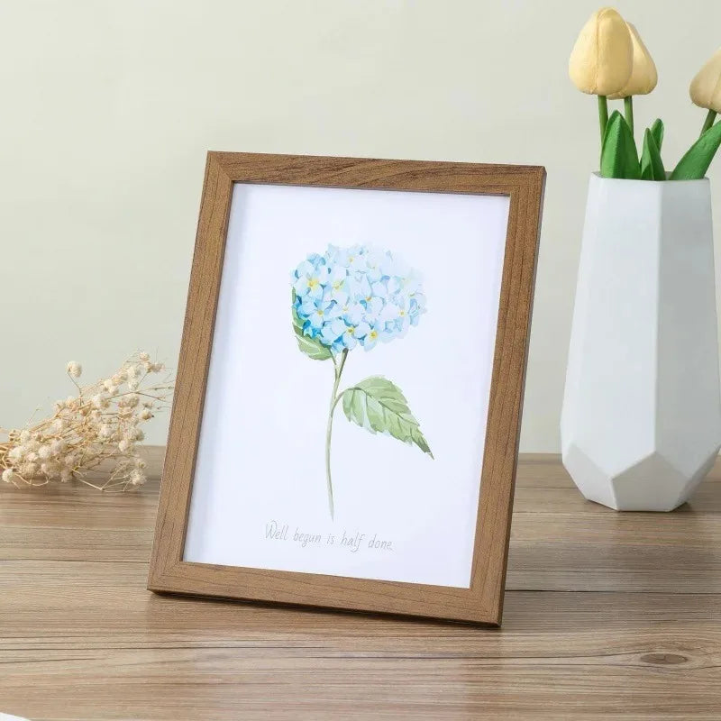 cadres photo bois clair marron modernes minimalistes suspensions posées impressions florales
