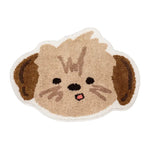 Tapis en forme de mignon chien aux yeux brillants et expression joyeuse.