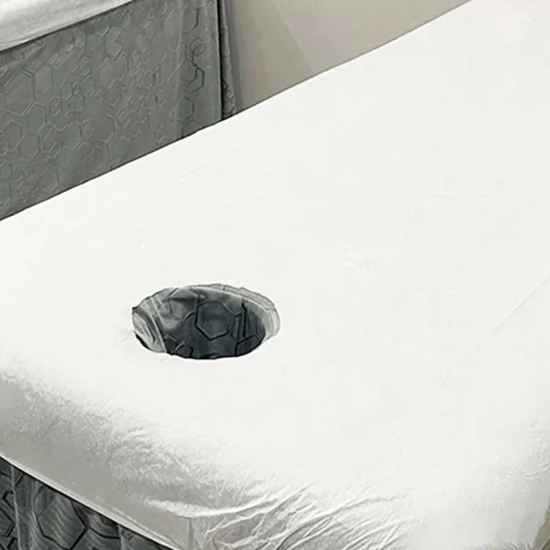 couverture table massage blanche tissu lisse hexagonal hygiène professionnel pliée relaxation salon beauté