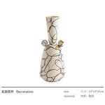 vase céramique moderne blanc noir orange motifs abstraits points bibliothèque décoration
