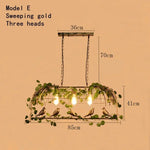 suspension lumineuse vintage oiseaux métal feuilles vert ampoules noir doré rustique