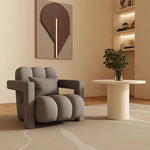 fauteuil moderne tissu texturé beige jaune marron clair coussin décoratif salon minimaliste