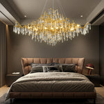 lampe suspendue or cristal moderne branches dorées pendeloques transparentes chambre salon