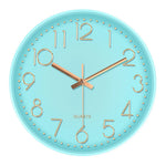 horloge murale cadre doré aiguilles noires numéros blancs moderne chambre coucher