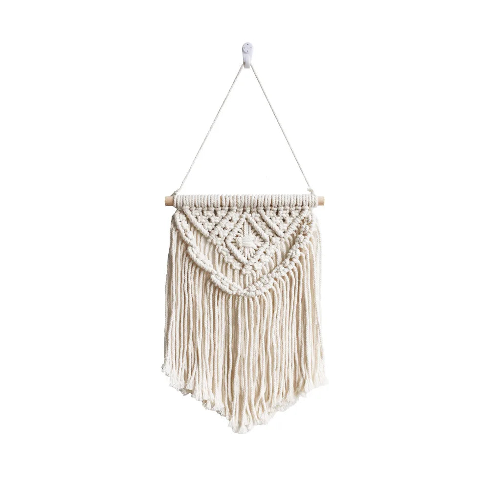 tapisserie macramé bohème beige clair motifs géométriques franges opaques décorative art murale