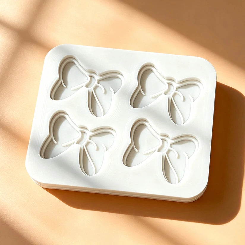 moule silicone nœuds papillons pâtisserie décorative couleurs variées fondant cupcakes