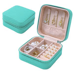 boîte bijoux simili cuir vert pastel moderne fermeture glissière blanc rose pâle boucles doreilles