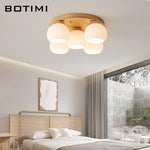 lampe moderne bois blanc abat jour verre motifs plissés éclairage chambre coucher