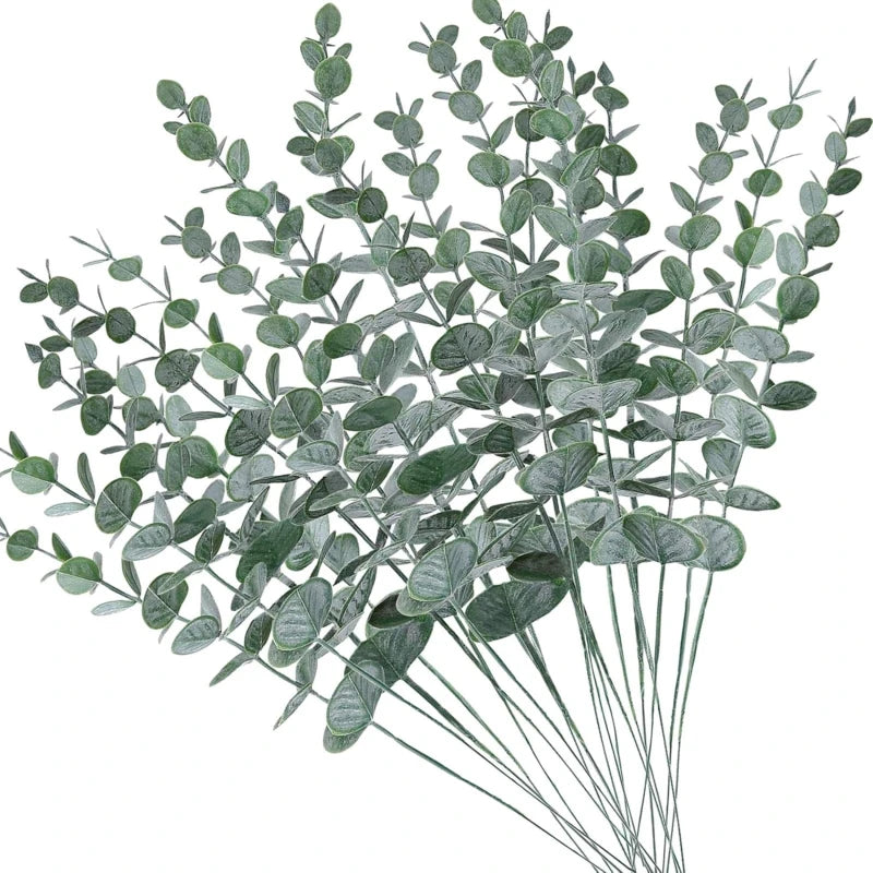 vase blanc moderne fleurs artificielles feuilles vertes décoration table intérieure