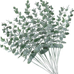 vase blanc moderne fleurs artificielles feuilles vertes décoration table intérieure