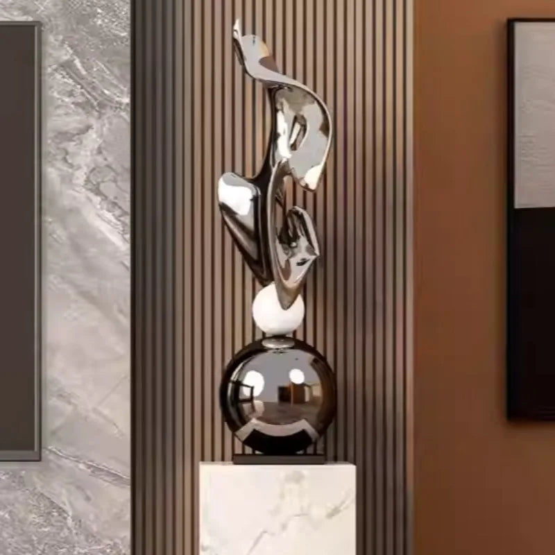 sculpture abstraite contemporaine argent doré forme organique base carrée intérieur salon nouveau classique minimaliste