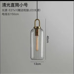 suspension lumineuse moderne gris fumé doré verre mat métal poli ampoule filament visible chambre