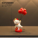 statue chat porte bonheur blanc doré artisanal détails dorés pochette rouge plateau texte rouge