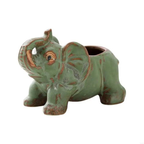 statuette éléphant céramique artisanale détaillée trous drainage fleurs jaunes orangées taches brunes opaque