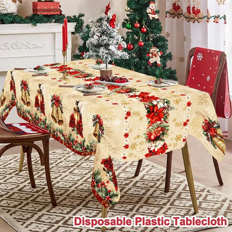nappe table noël cloches dorées fleurs rouges feuilles vertes guirlandes flocons dorés classique