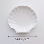 assiettes blanches modernes céramique lisses rangement présentation alimentaire set tailles différentes