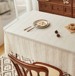 nappe table beige crème motif texturé rustique franges pompons décoration salle manger
