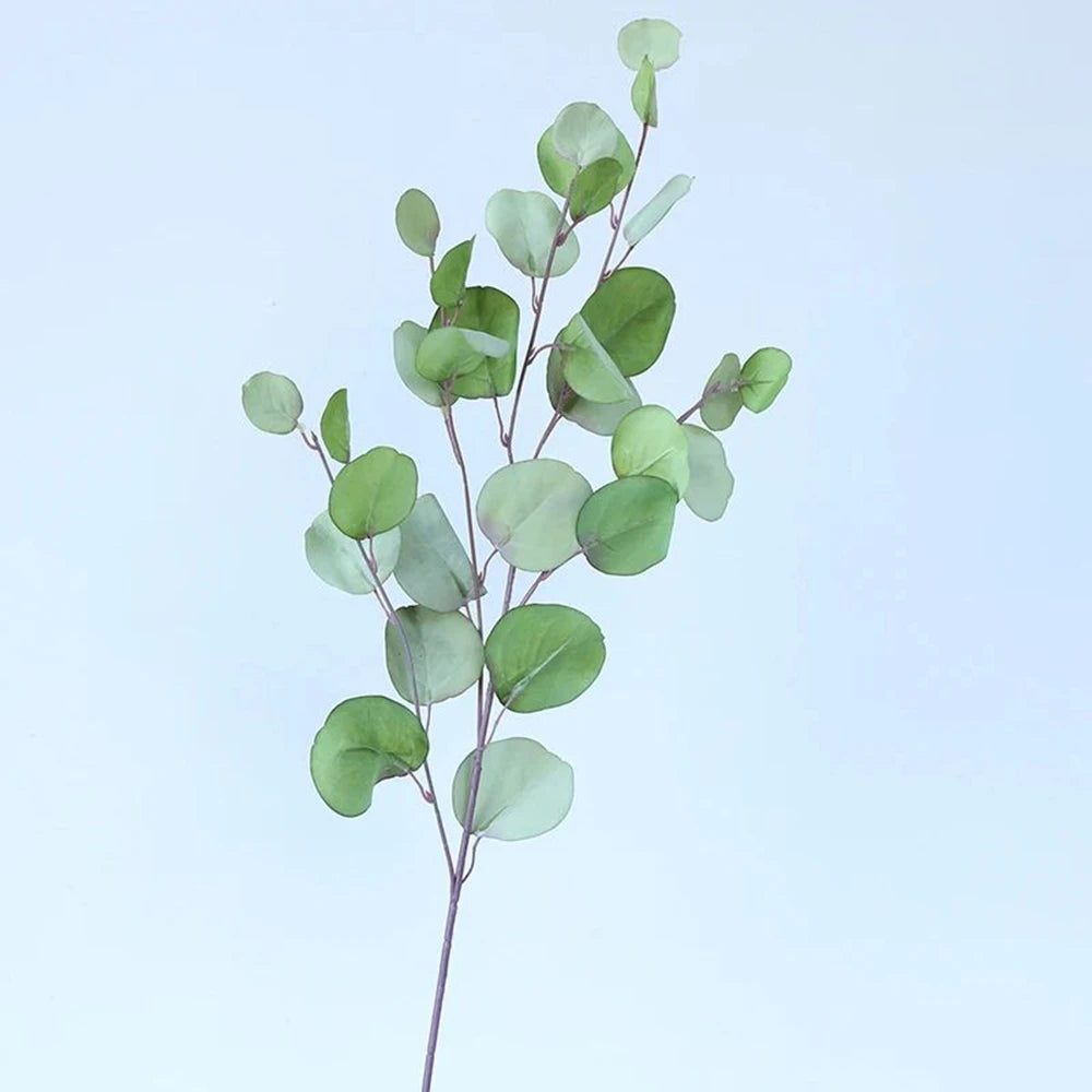bouquet artificiel feuilles ovales moderne vase transparent support doré couleurs vives exposition intérieure