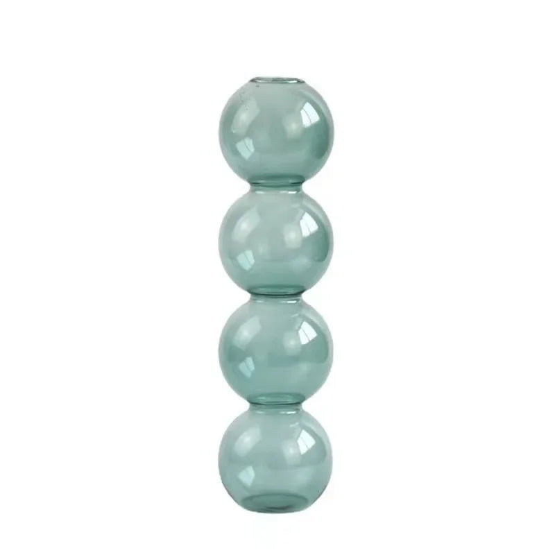 vases transparents modernes sphères empilées bleu vert marron beige