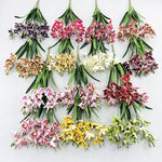 bouquet fleurs artificielles orchidées cymbidium roses blanches violettes jaunes décoration intérieure maison moderne minimaliste