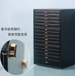 coffret bijoux moderne simili cuir noir blanc vert compartiments poignées dorées stockage sécurité