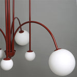 lustre moderne rouge noir doré sphères blanches opaques suspension salon chambre
