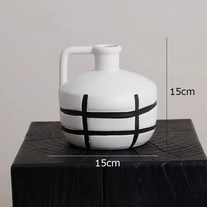 vase céramique rayures noires blanches moderne décoration intérieure arrangement fleurs artificielles minimaliste