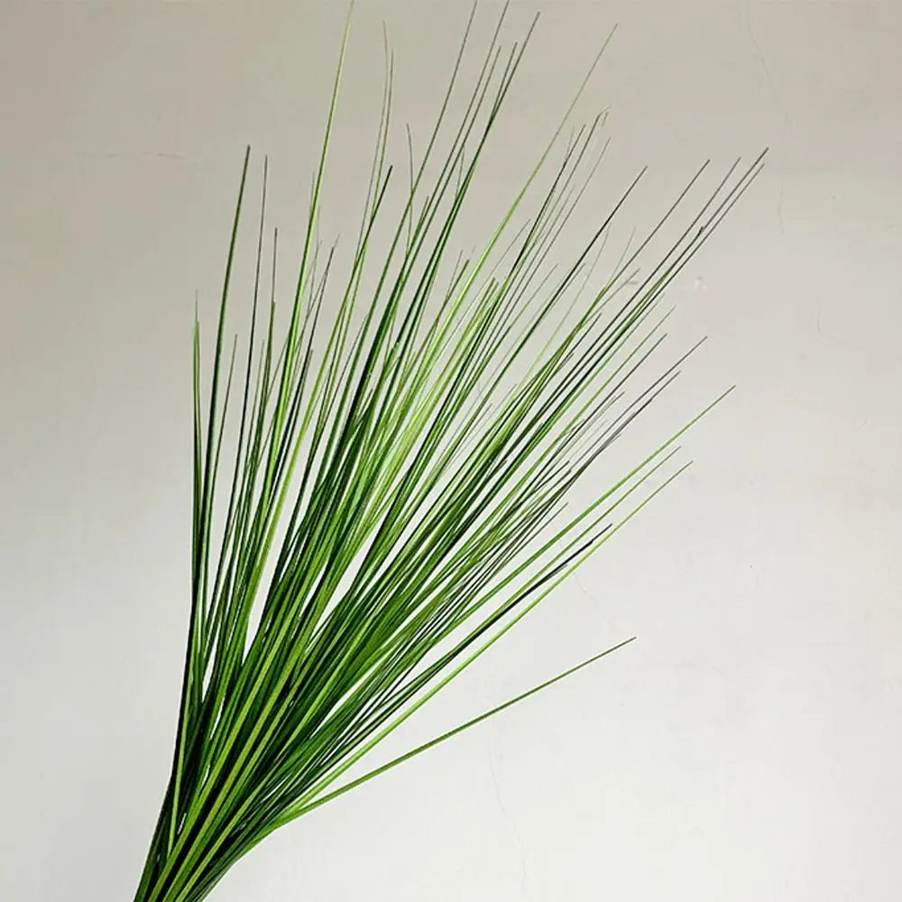 branche artificielle verte vase transparent extérieur naturel minimaliste feuilles ovales fleurs blanches exposition anniversaireDecorationJardinFeteMaison
