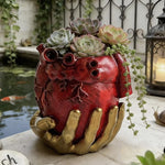 pot fleurs cœur anatomique rouge mains dorées plantes succulentes décoratives escargot poisson love speech