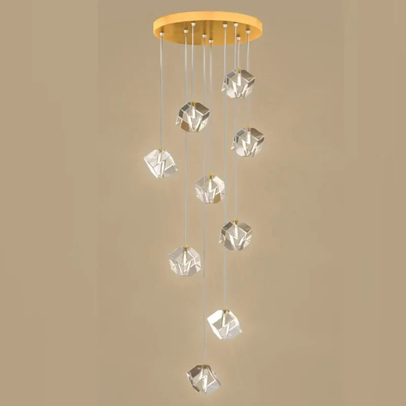 suspension lumineuse moderne transparente dorée facettes géométriques élégantes multiples lampes