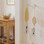 porte sacs porte serviettes chaîne boucle moderne décoratif acier inoxydable doré feuille stylisée