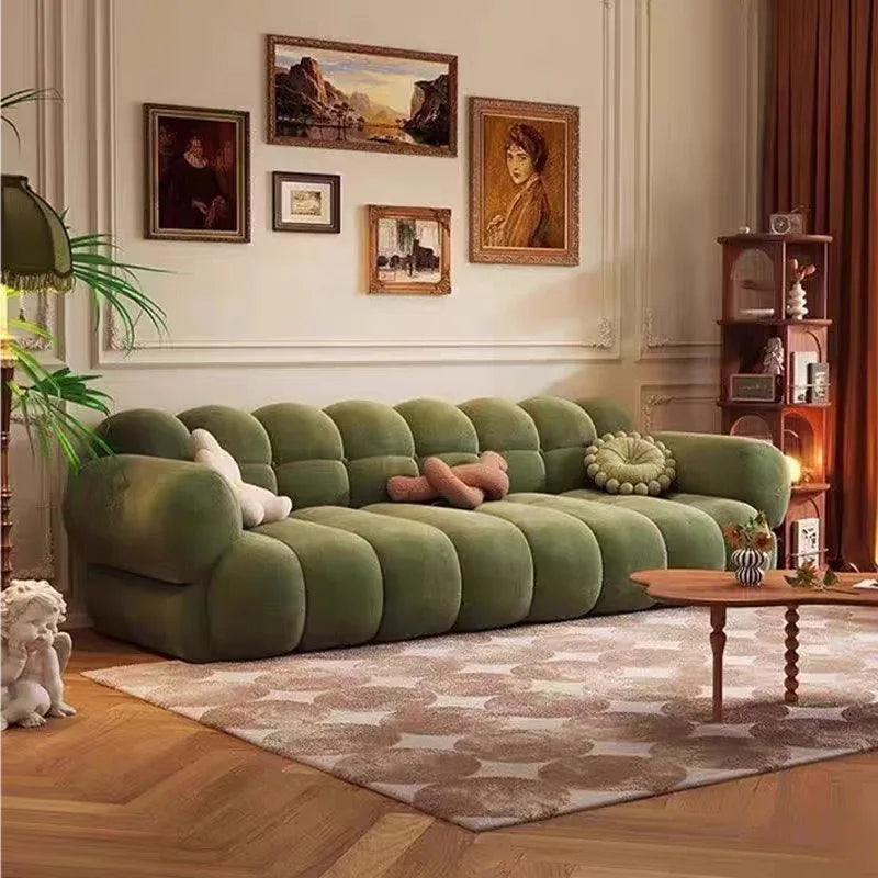 canapé moderne velours beige marron olive salon contemporain coussins différentes tailles