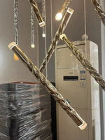 suspension lumineuse contemporaine dorée spirale brillante salon restaurant chambre principal