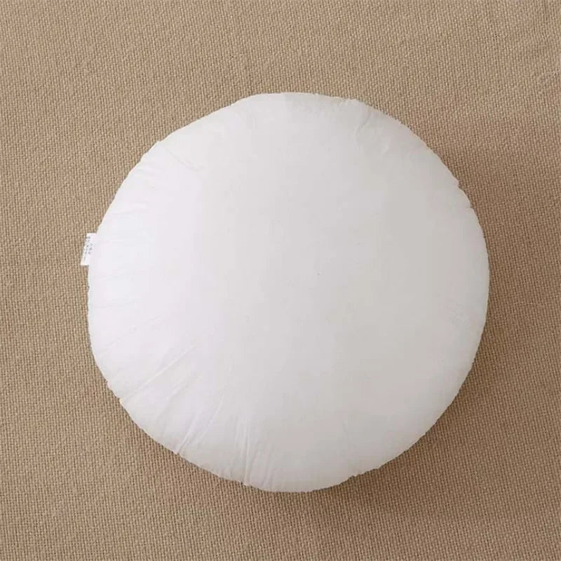 Coussin rond blanc détail texture coton tissé