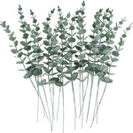 vase blanc moderne fleurs artificielles feuilles vertes décoration table intérieure
