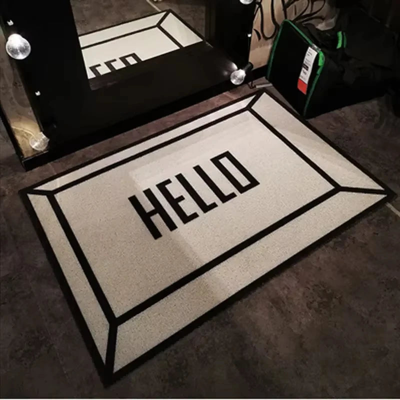 tapis d'entrée moderne motifs géométriques lettrage HELLO illustration canette soda orange blanc