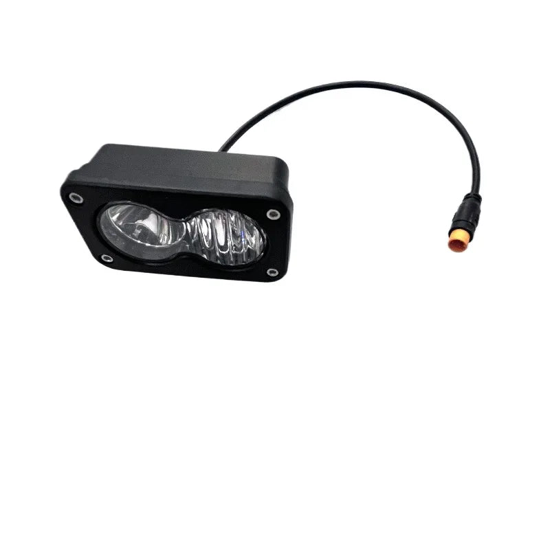 lampe travail moderne robuste noire lentilles jaunes vis fixation câble connecteur orange