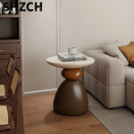 table basse ronde pierre moderne minimaliste sculptural couleur vive salon