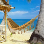 hamac vert turquoise tissu uni franges bohème fixations bois sac rangement
