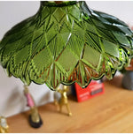 suspension lumineuse vintage vert doré motifs géométriques ampoules câbles chaînes métal