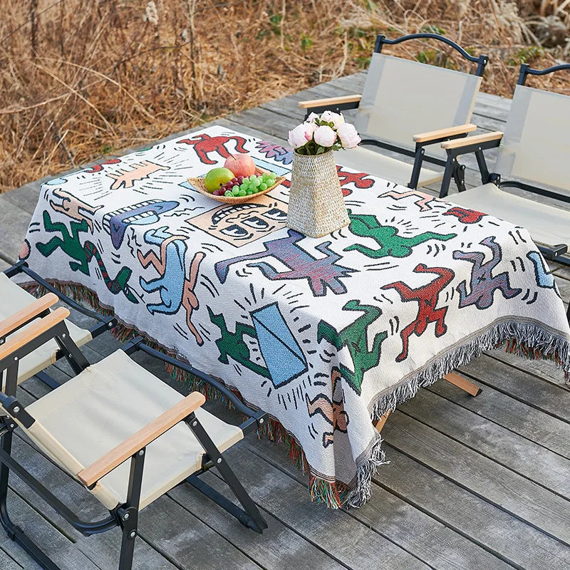 serviette table moderne ethnique motifs géométriques franges couleurs vives blanc bleu orange rouge noir