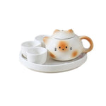 théière forme chat blanc orange rose visage mignon oreilles pointues taches oranges decorative cartoonish