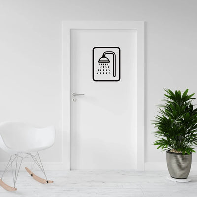 Sticker mural pomme de douche noir sur mur blanc salle de bain