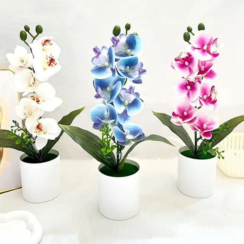 décoration intérieure orchidées artificielles pots blancs fleurs simples feuilles vertes moderne
