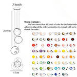 lampes suspendues modernes sphères colorées brillantes intensité variable transparentes opaques chambre salon