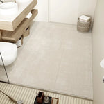 Carrelage de salle de bain élégant aux motifs géométriques dans des tons neutres et naturels.