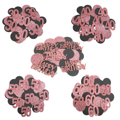 Confettis anniversaire or rose sur table de fête décorée