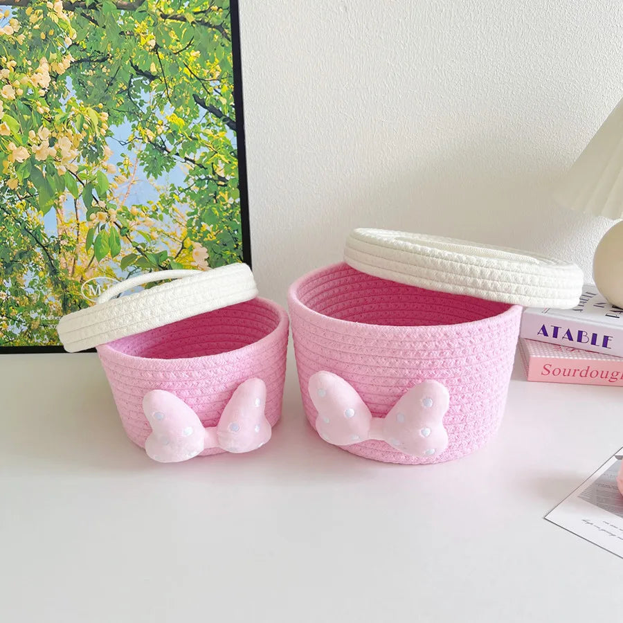 panier rangement rose blanc rayures horizontales noeud décoratif réutilisable polyestère enfantin cordelette organisation jouets