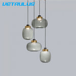 suspension lumineuse moderne transparente dorée ampoule câble noir minimaliste salle manger chambre