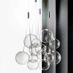 suspension lumineuse moderne sphères brillantes or argent transparentes chambre salle manger